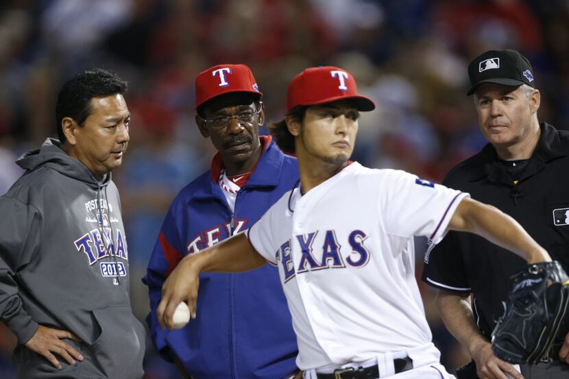 Texas Rangers starting pitcher Yu Darvish (11) pitches through an injury in the 7th inning...