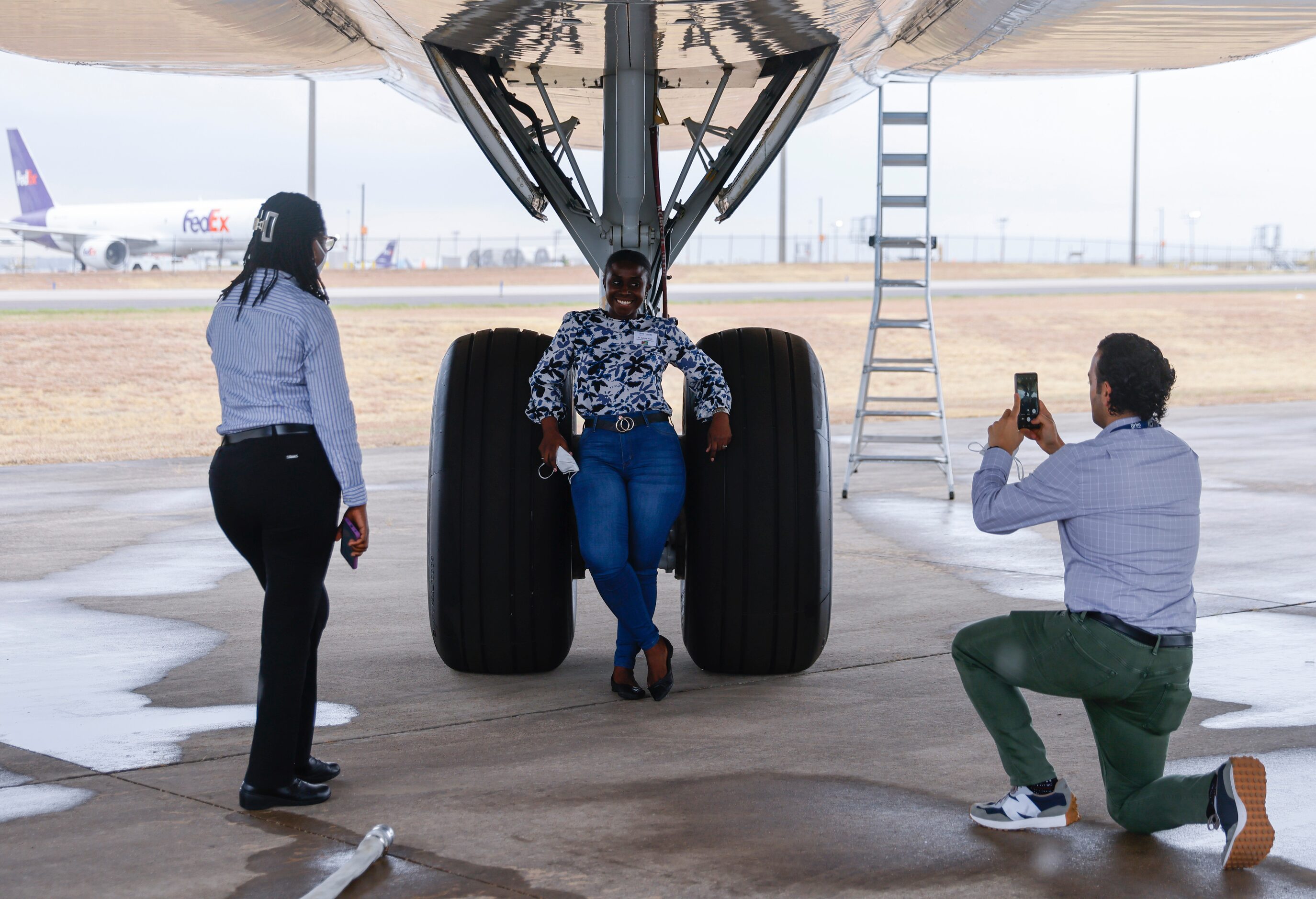 Orbis Flying Eye Hospital medical volunteer Soroosh Behshad, right, takes a photo of...