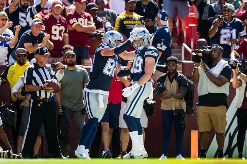 Dallas Cowboys tight end Jason Witten (82) celebrates a touchdown with tight end Blake...