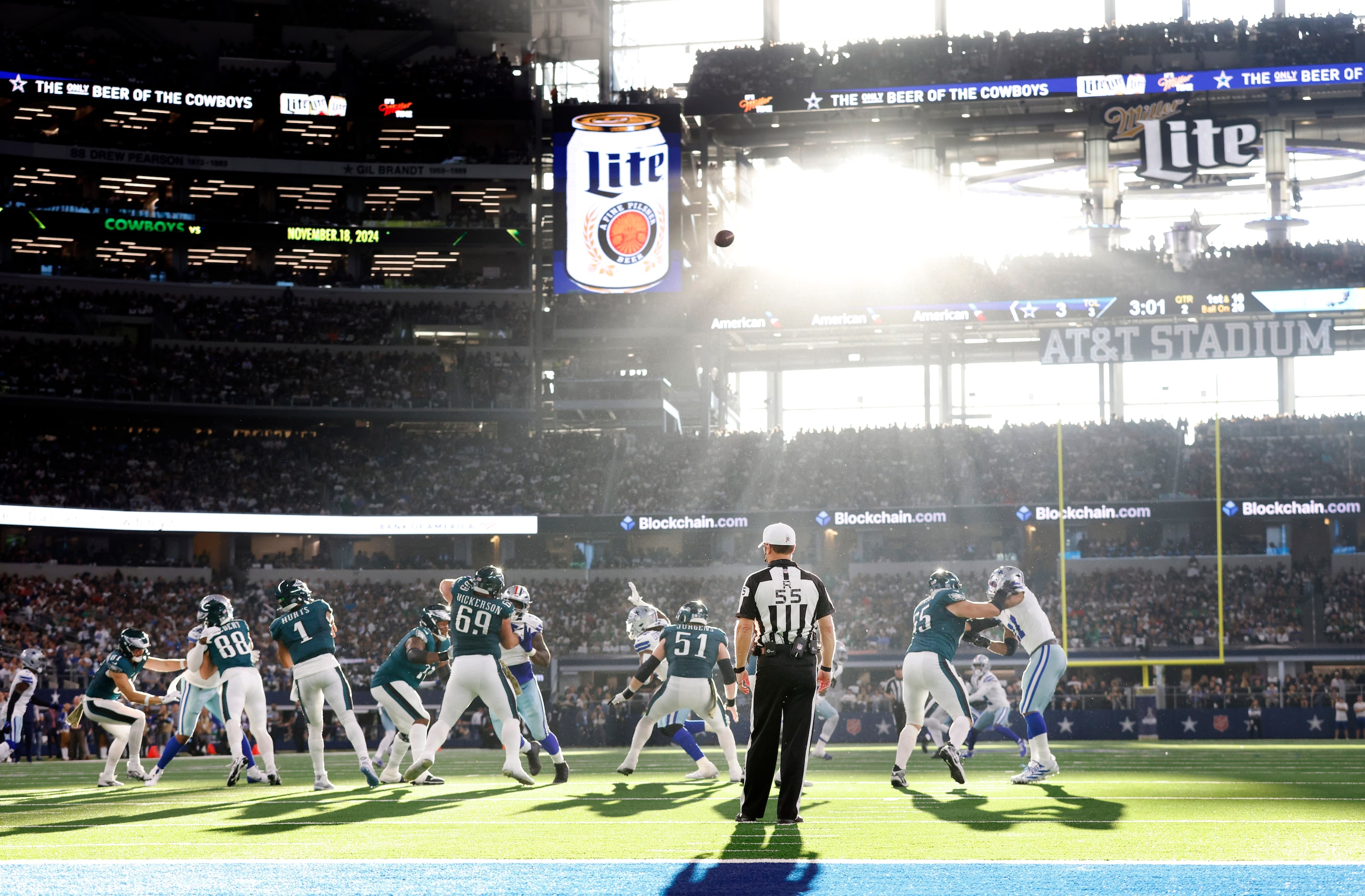 Philadelphia Eagles quarterback Jalen Hurts (1) releases a pass into the setting sun as...