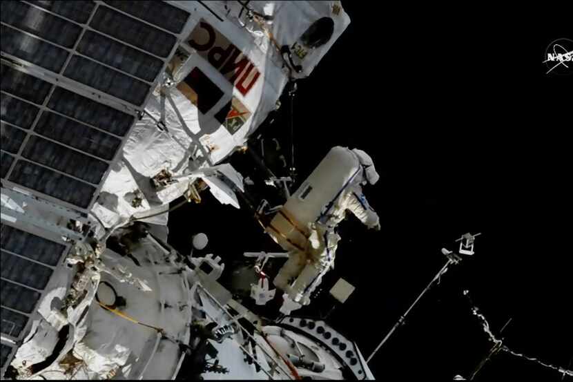 In this image made from a video, cosmonaut Sergey Prokopyev flings a Sirius nano-satellite...