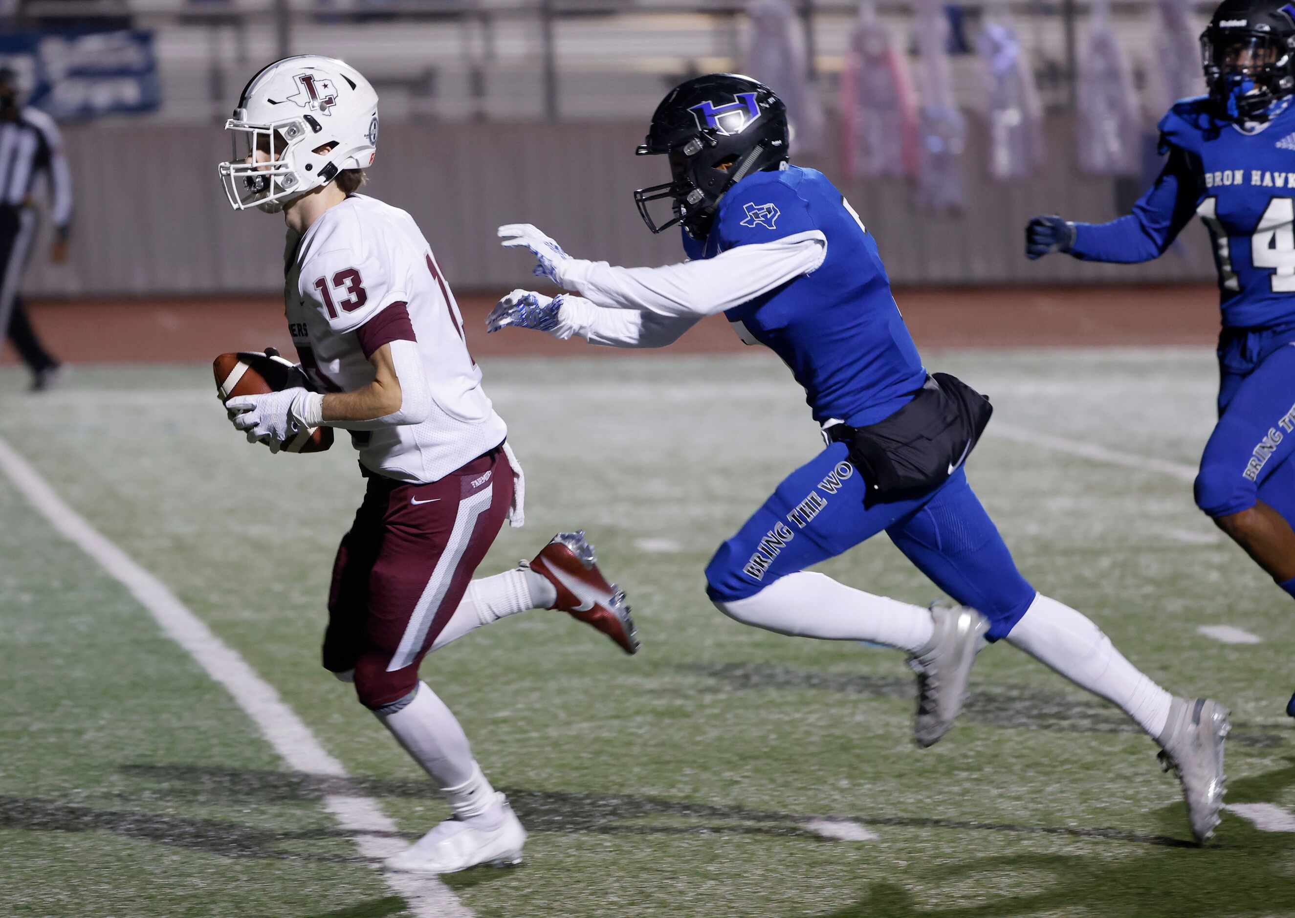 Lewisville receiver Brent Allen (13) scores a a touchdown as he is chased by Hebron’s...