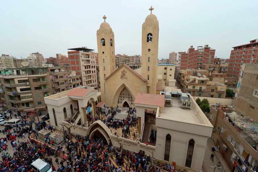 A general view shows people gathering outside the Mar Girgis Coptic Church in the Nile Delta...