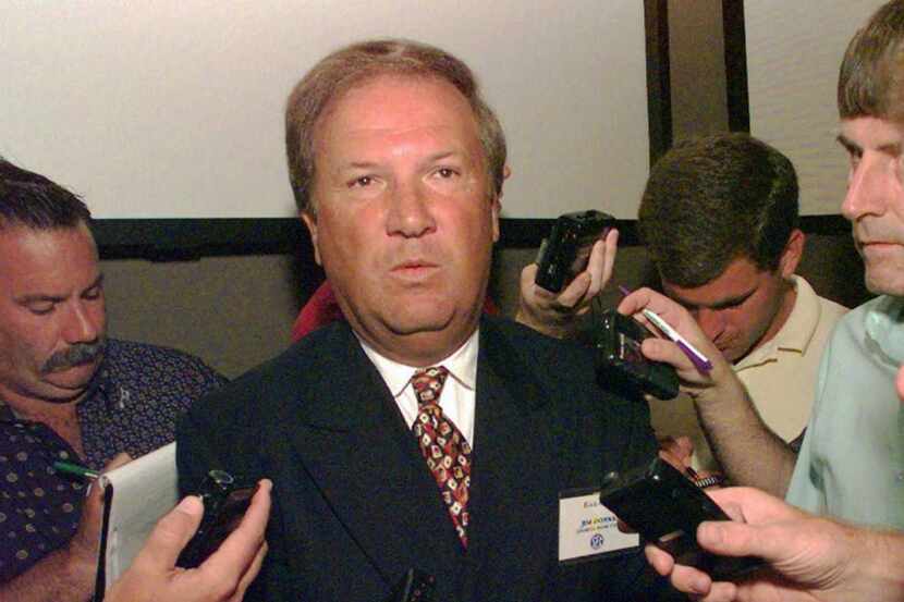 Former Georgia coach Jim Donnan talks with reporters in Birmingham, Ala., July 30, 1997.