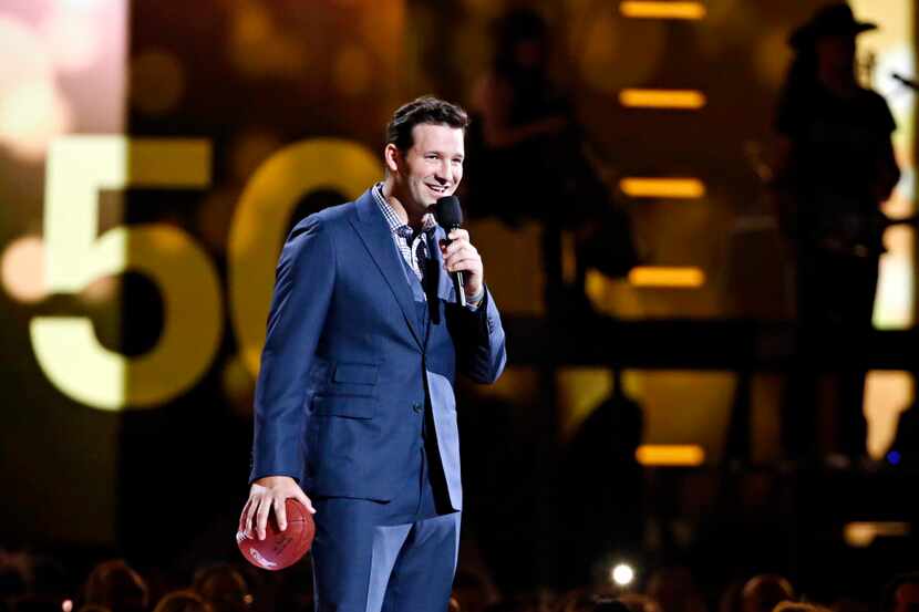 Dallas Cowboys quarterback Tony Romo stands on stage during the 2015 Academy of Country...