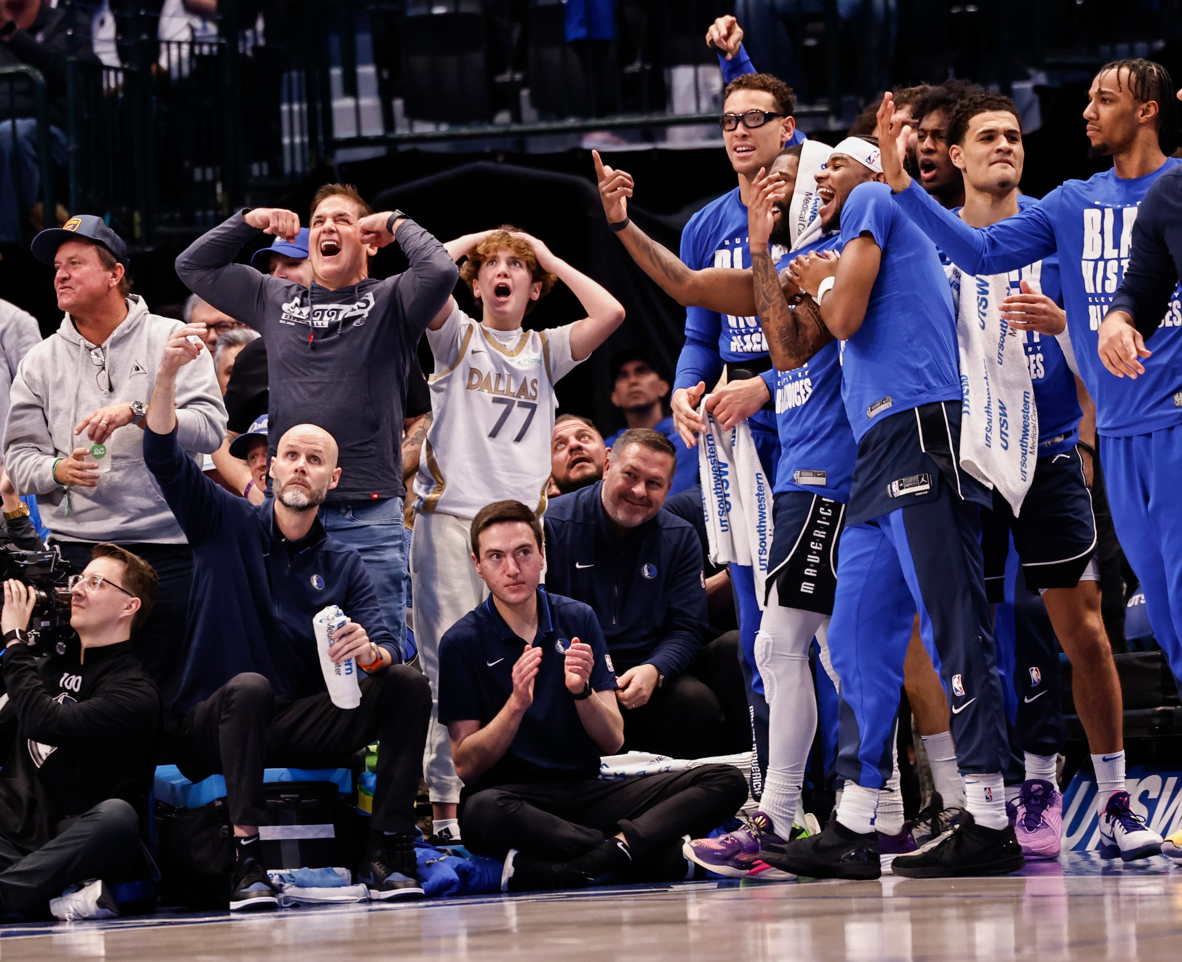 Dallas Mavericks part-time owner Mark Cuban and other staff and players celebrate a...