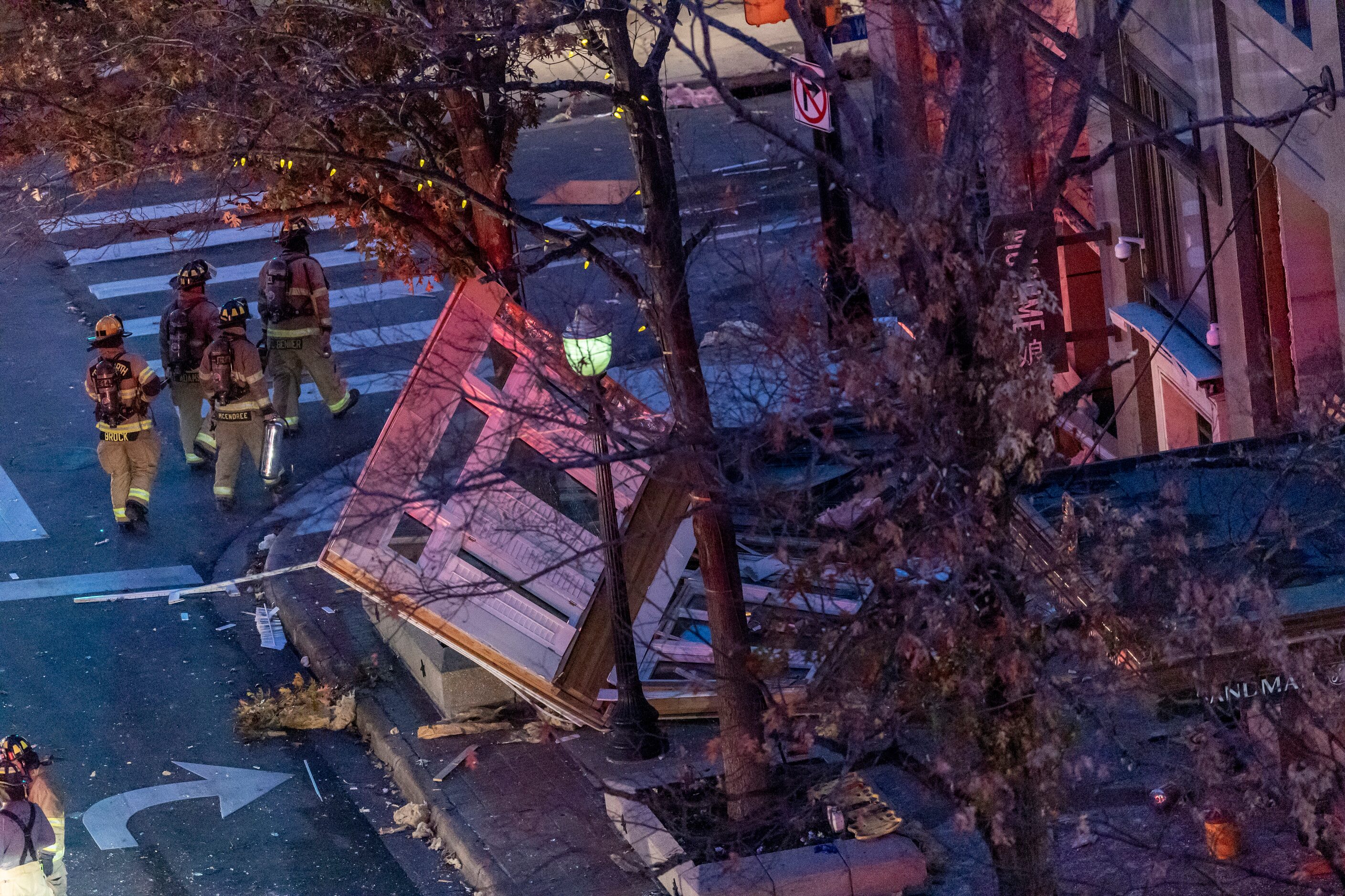 Fort Worth firefighters survey the damage after eleven people were injured in an explosion...