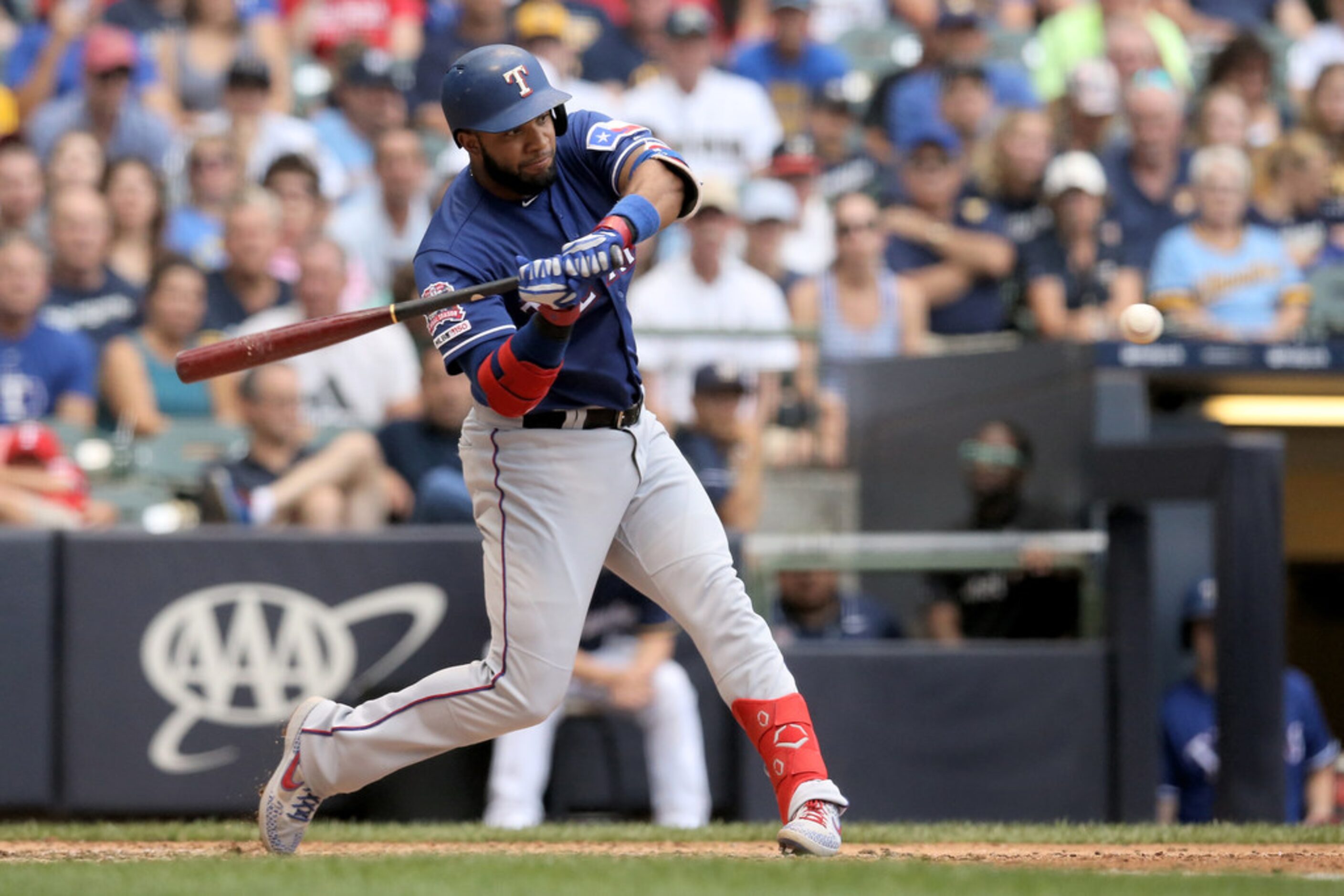 MILWAUKEE, WISCONSIN - AUGUST 11:  Elvis Andrus #1 of the Texas Rangers hits a single in the...