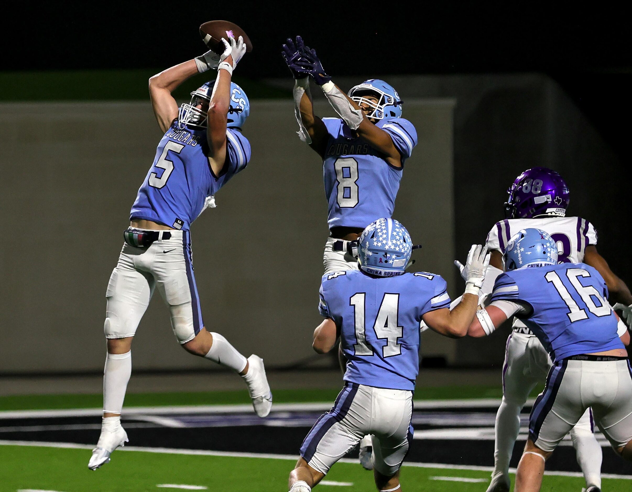 China Spring linebacker Tristan Exline (5) goes up for an interception against Anna during...