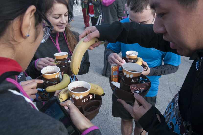 At the end of the Hot Chocolate 15k/5k at Fair Park on Saturday, Feb. 7, 2015 runners were...