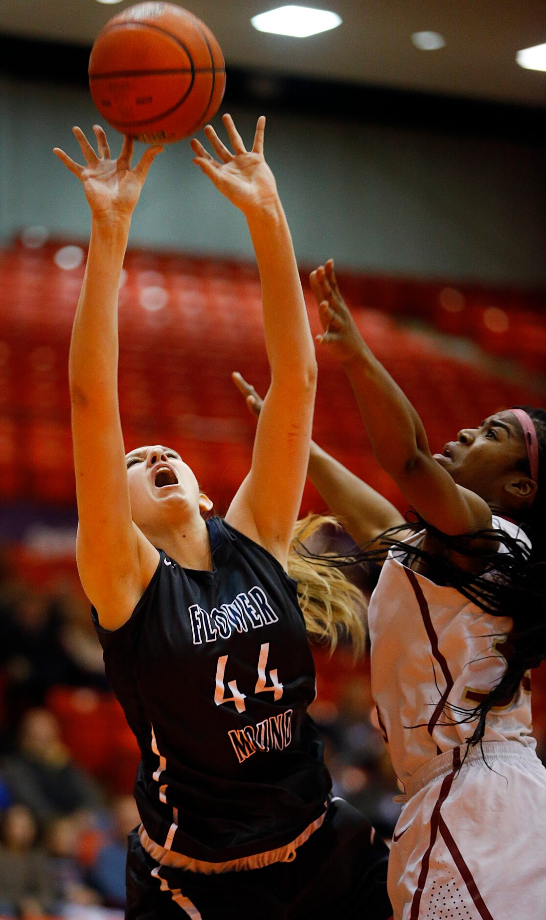 Flower Mound center Lauren Cox (44) is fouled by El Paso El Dorado forward Adeola Akomolafe...