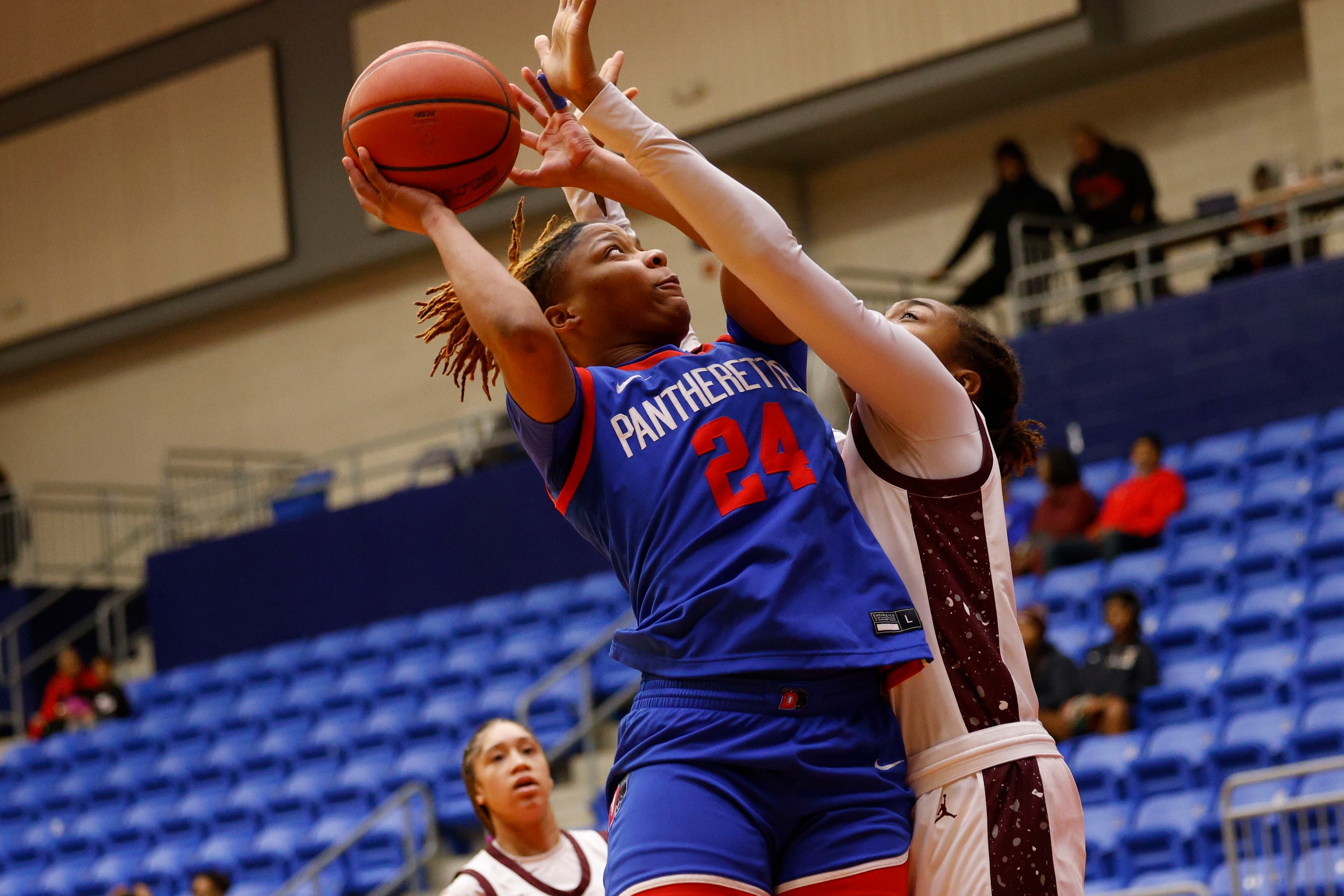 Duncanville's Kierston Russell (24) shoots over Pearland's Eliece Perry (12) during the...