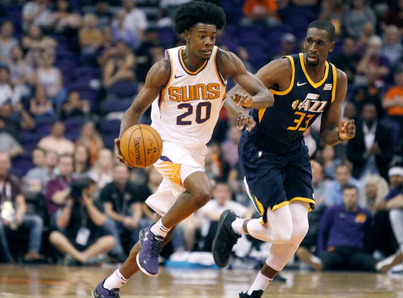 Phoenix Suns forward Josh Jackson (20) advances the ball up-court on a fast break as Utah...