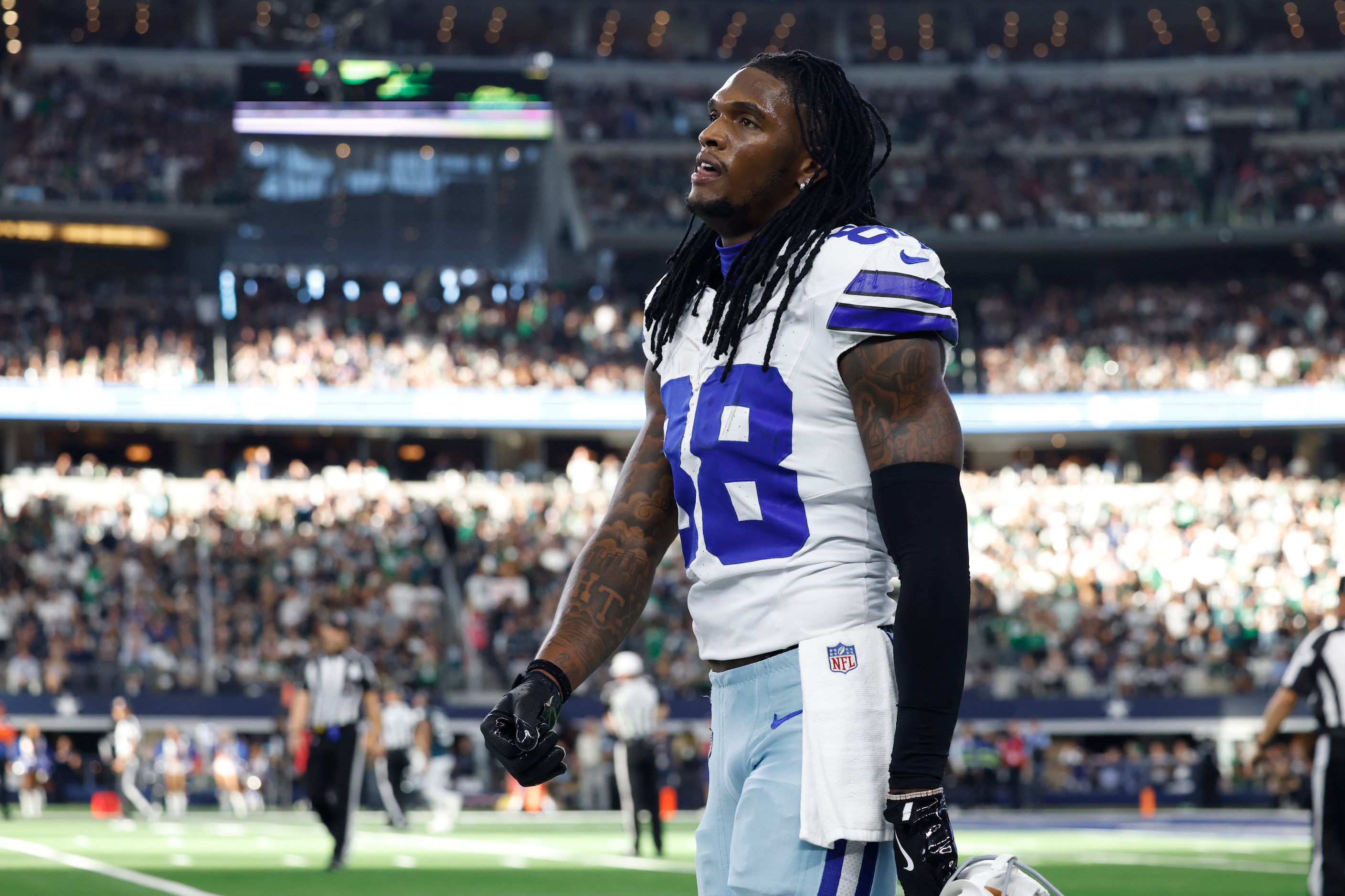 Dallas Cowboys wide receiver CeeDee Lamb (88) walks off the field after a fumble by running...