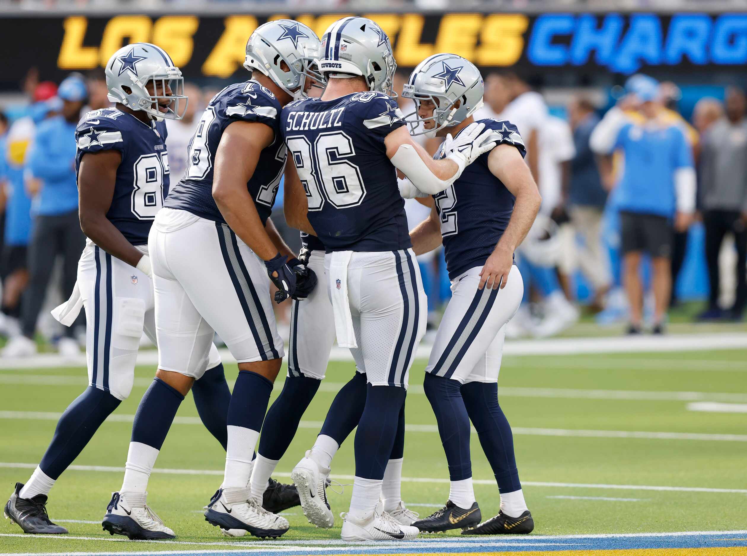 Dallas Cowboys place kicker Greg Zuerlein (2) is congratulated by teammates after kicking...