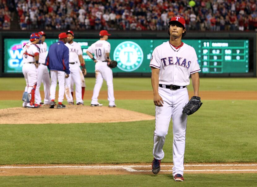 Texas Rangers starting pitcher Yu Darvish (11) is pulled from the game against the Baltimore...