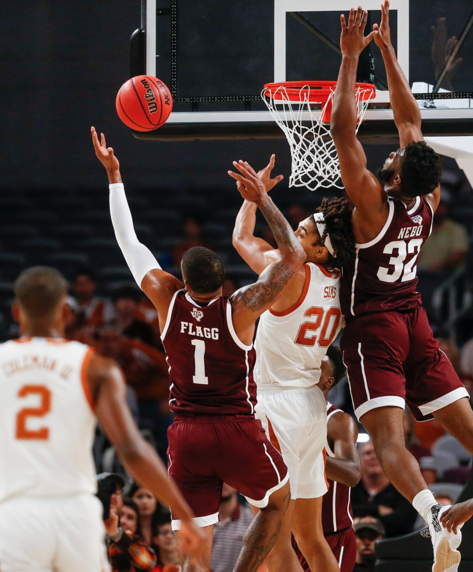 Texas A&M Aggies guard Savion Flagg (1) and forward Josh Nebo (32) battle with Texas...