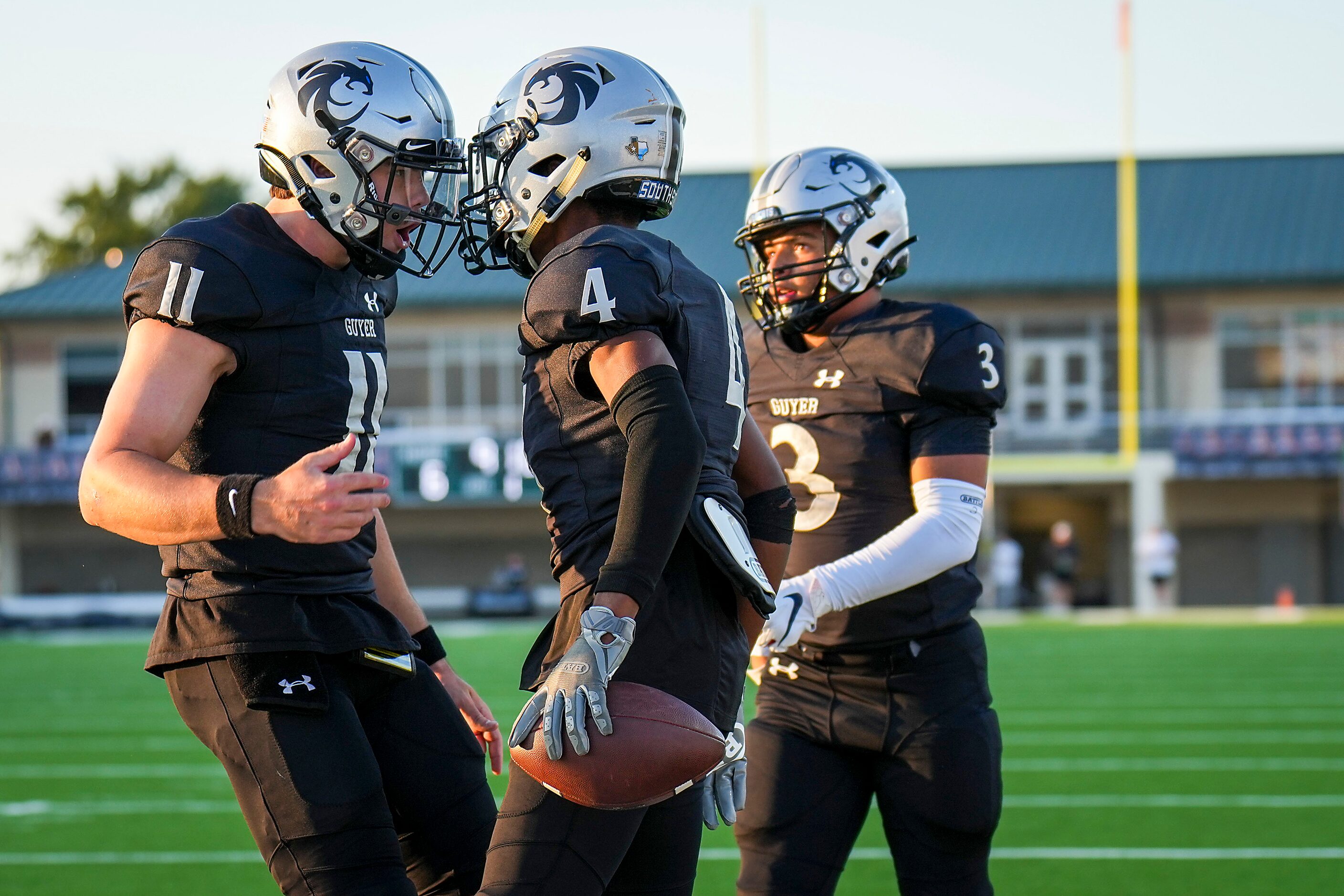 Denton Guyer quarterback Jackson Arnold (11) celebrates with wide receiver Josiah Martin (4)...