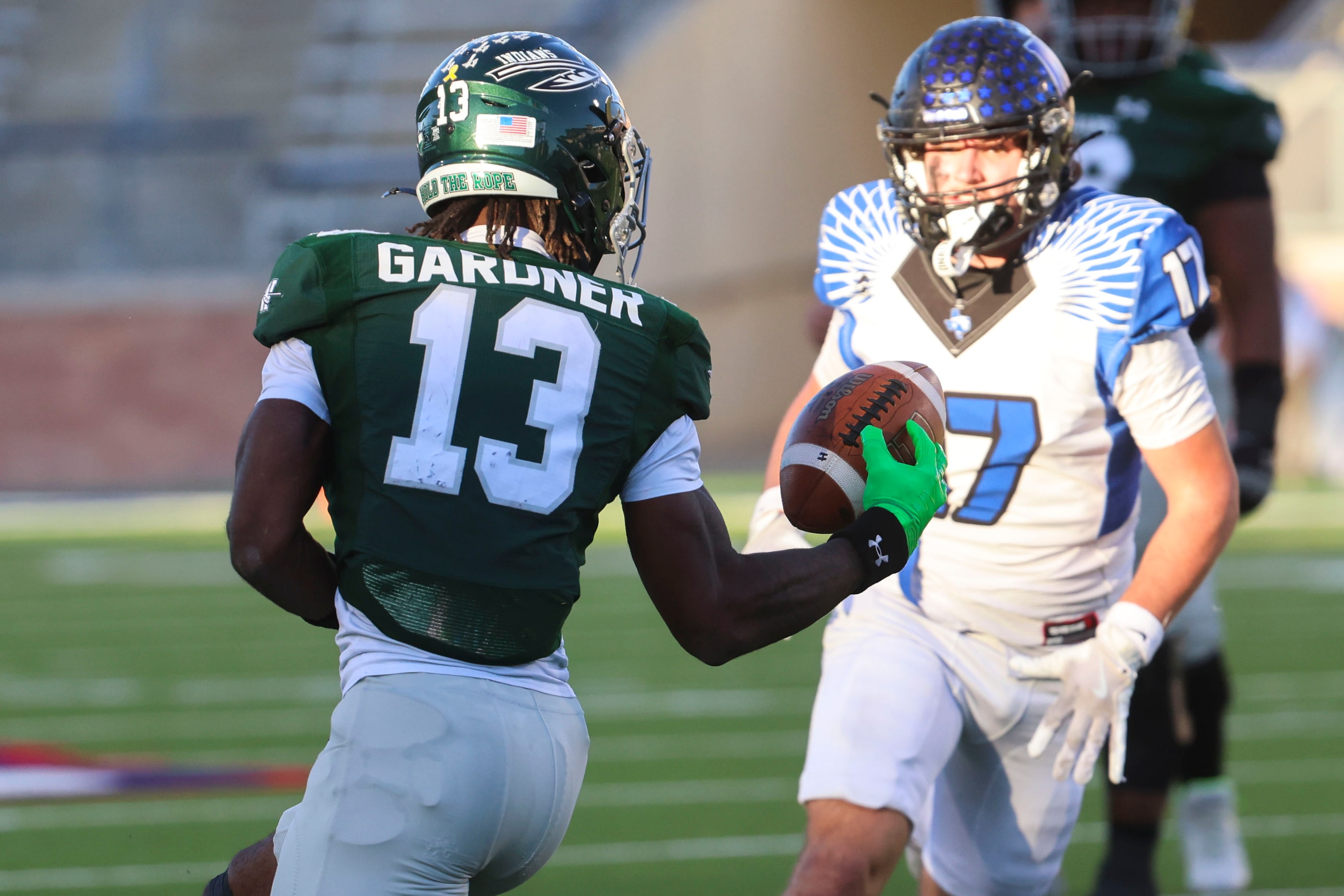 Waxahachie High’s Tristian Gardner (13) receives a pass as North Forney High’s Staten...