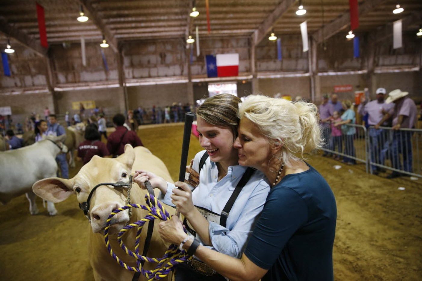 Laurel Kelley, 15, gets a hug from her mother, Jennifer Kelley after Laurel won the Grand...