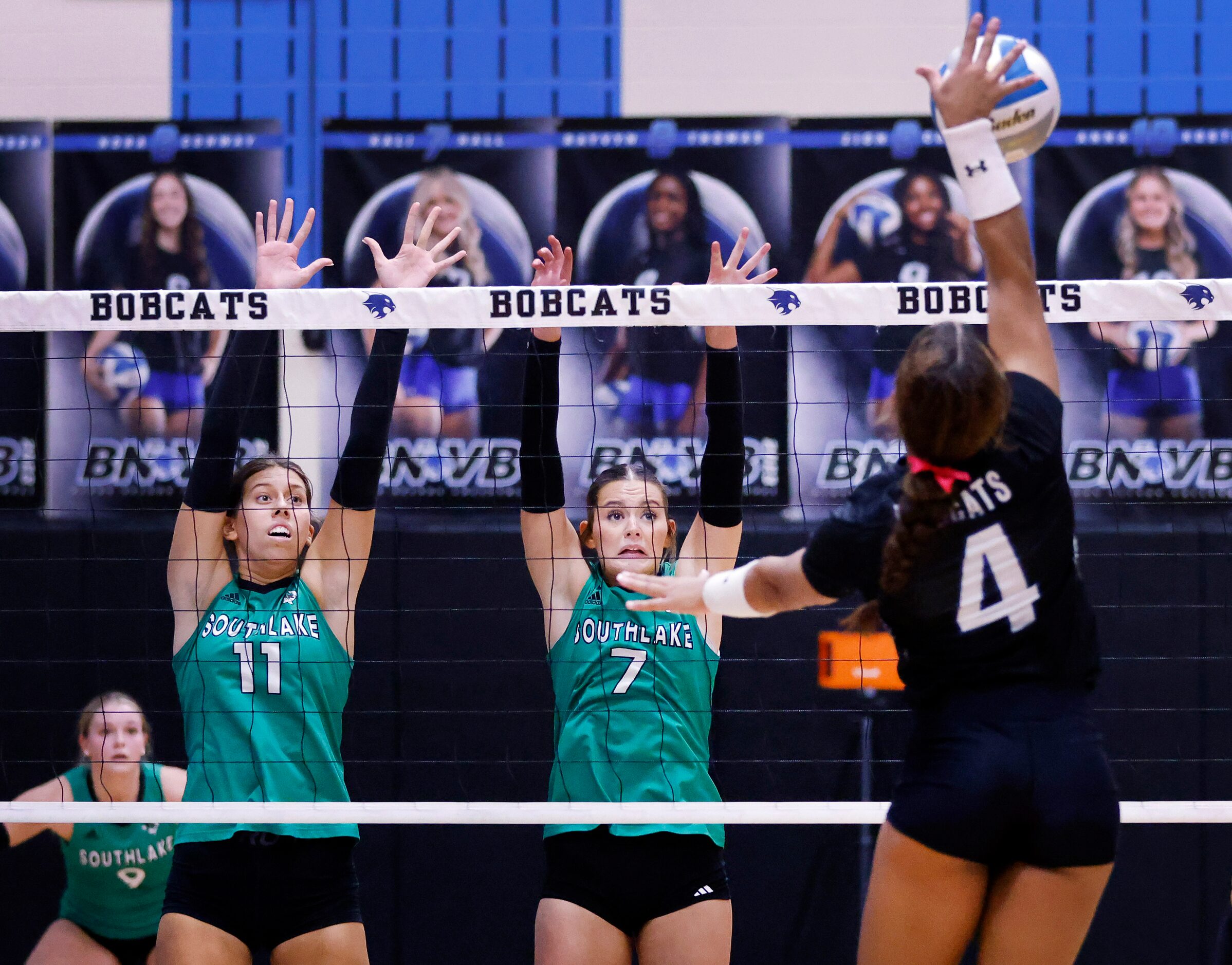 Southlake Carroll’s Tavlor Starr (11) and Layla Austin (7) look to block a shot by at Trophy...