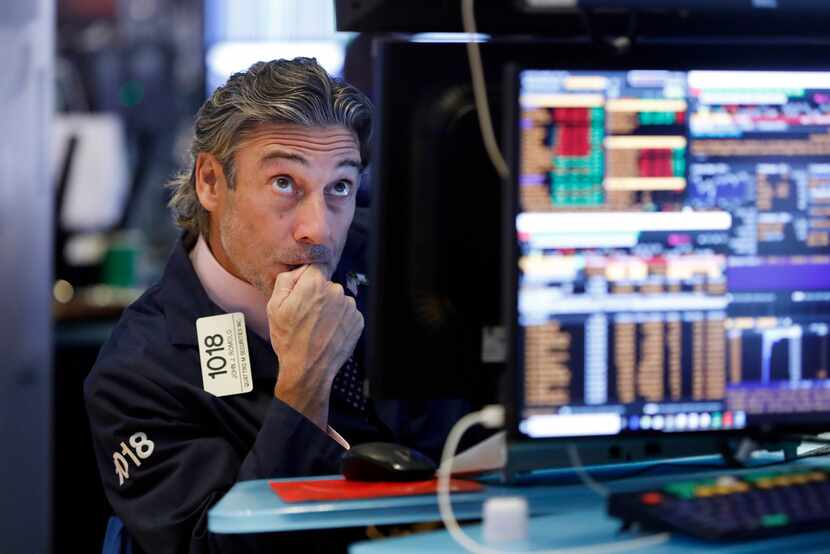 Trader John Romolo works on the floor of the New York Stock Exchange on Wednesday.