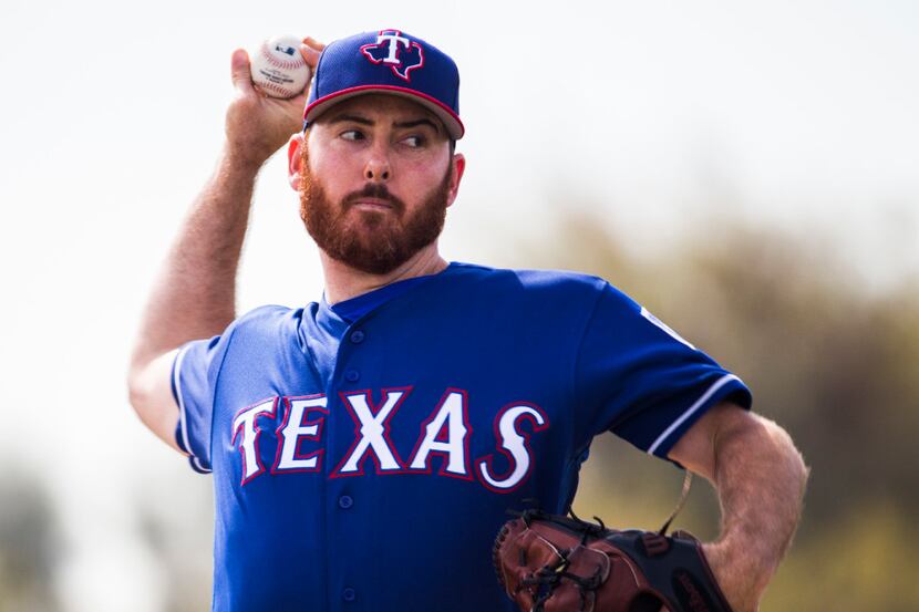 Texas Rangers relief pitcher Sam Dyson (47) throws for live batting practice during a spring...