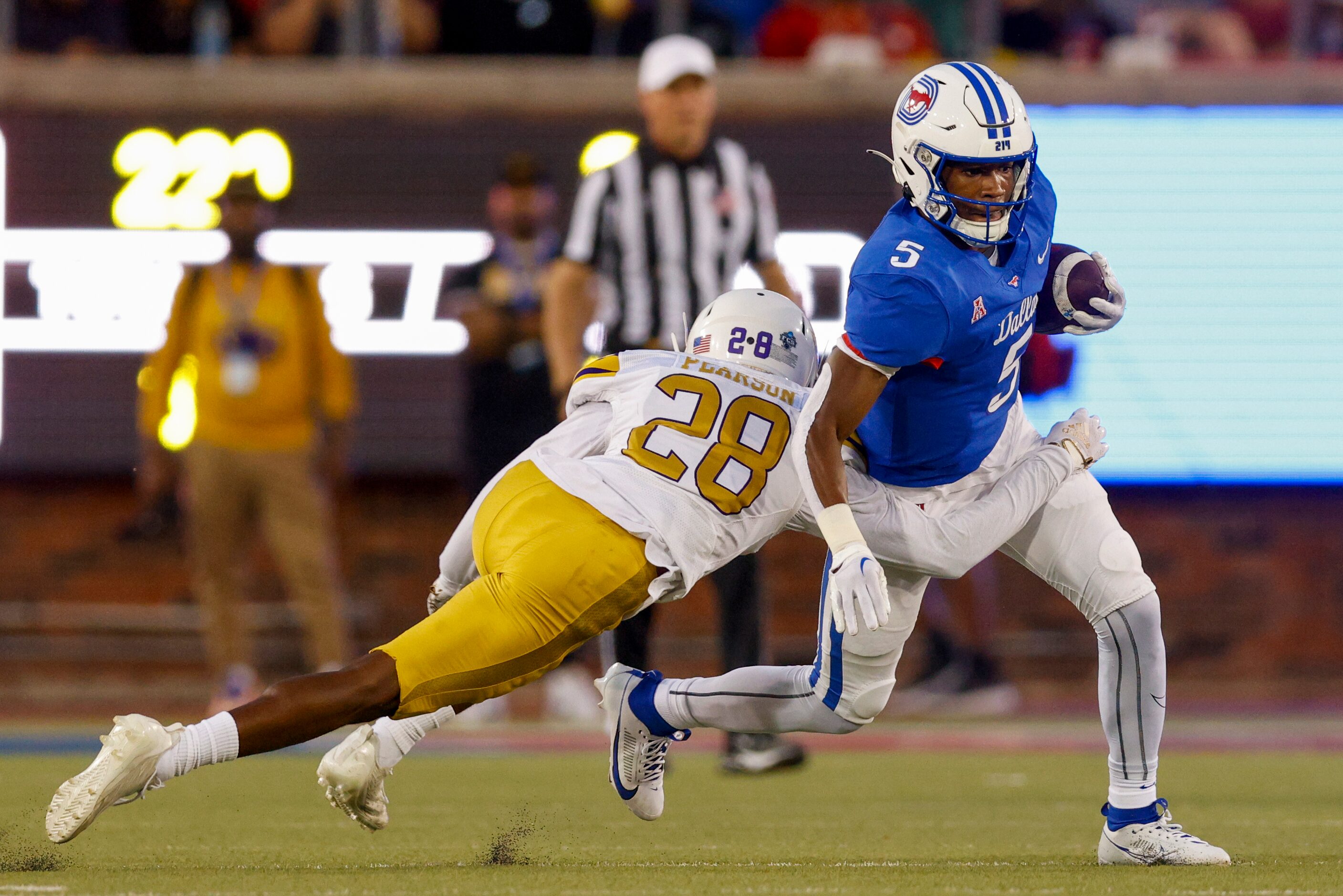 Prairie View A&M defensive back Travis Pearson II (28) tackles SMU wide receiver Moochie...