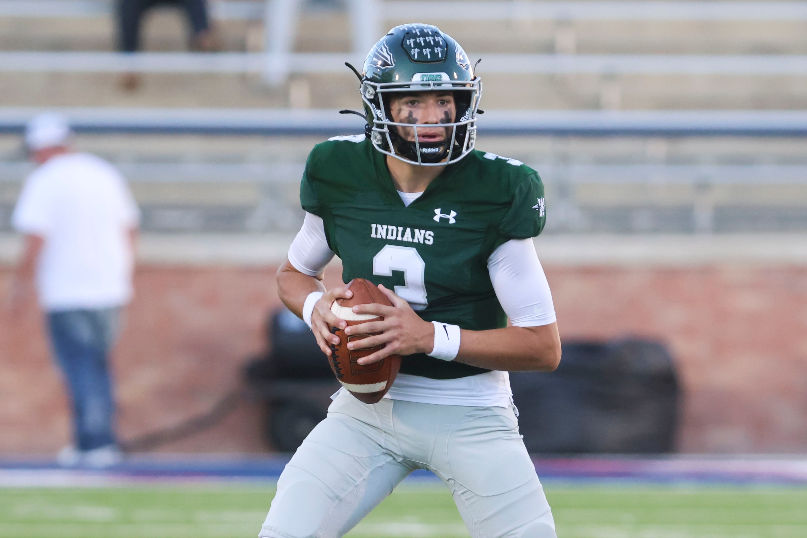 Waxahachie High’s QB Jerry Meyer III looks to throw the ball against North Forney High...