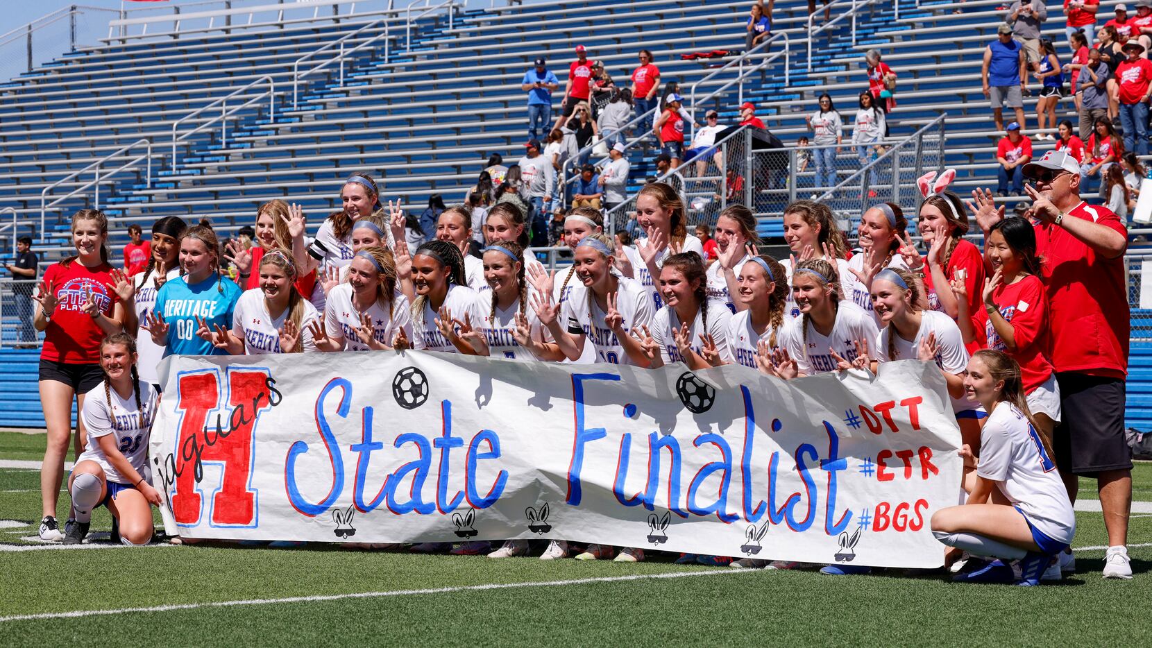 The Midlothian Heritage team poses with a state finalist banne after defeating Lumberton in...