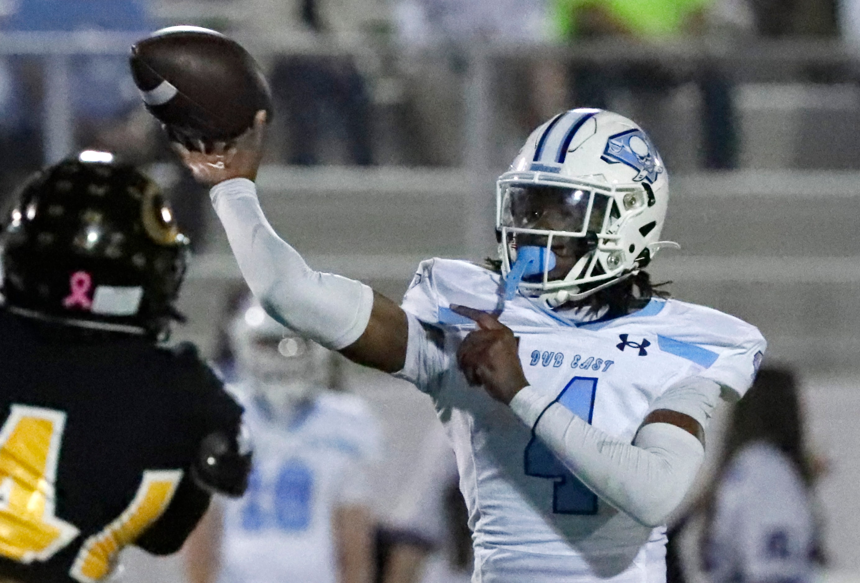 Wylie East High School quarterback Howard Fisher IV (4) throws a touchdown pass during the...