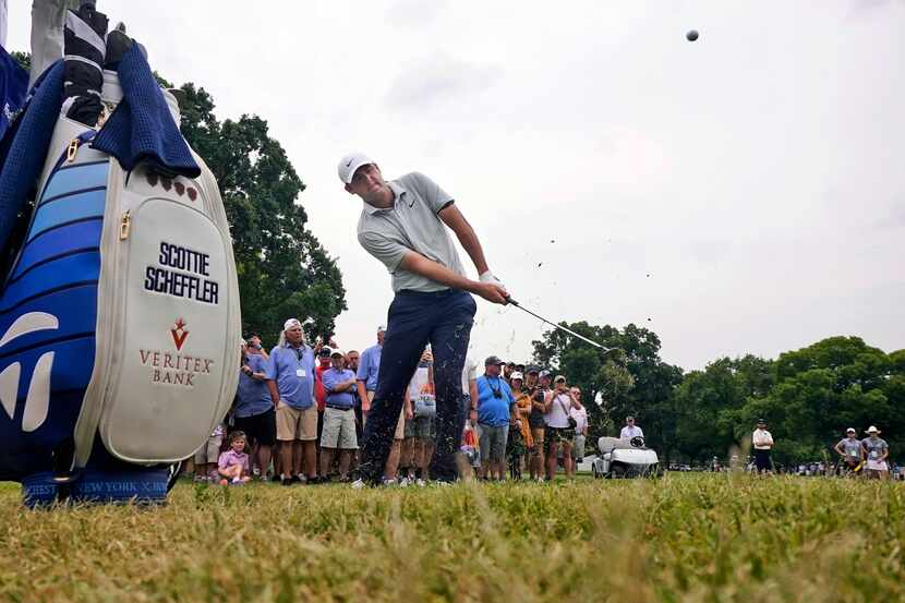 Scottie Scheffler hits from the gallery onto the second green during the third round of the...