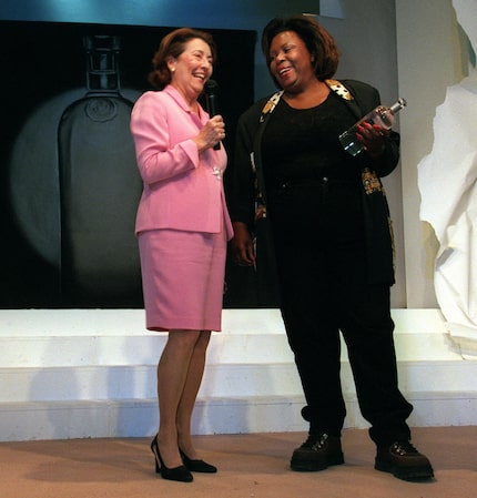 Terry Costa accepts The ' Absolut Initiative award drom DDI president Gloria Agyemang in 2003.