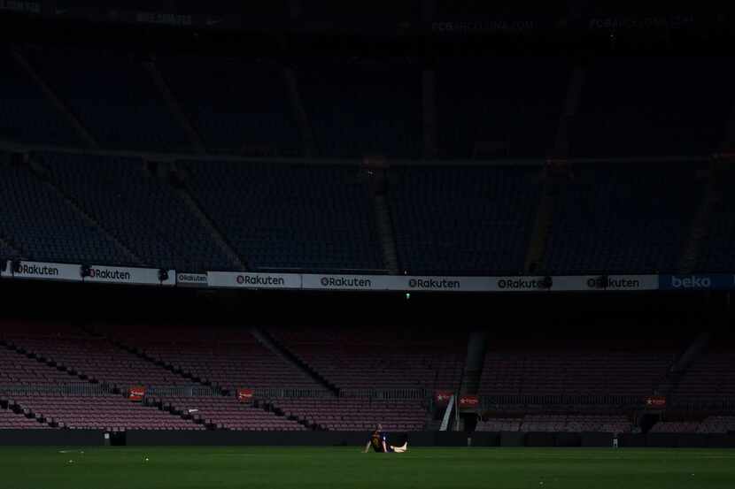 BARCELONA, SPAIN - MAY 20: Andres Iniesta of FC Barcelona sits on the pitch at the end of La...
