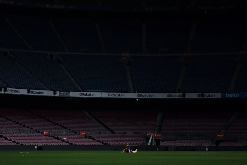 BARCELONA, SPAIN - MAY 20: Andres Iniesta of FC Barcelona sits on the pitch at the end of La...