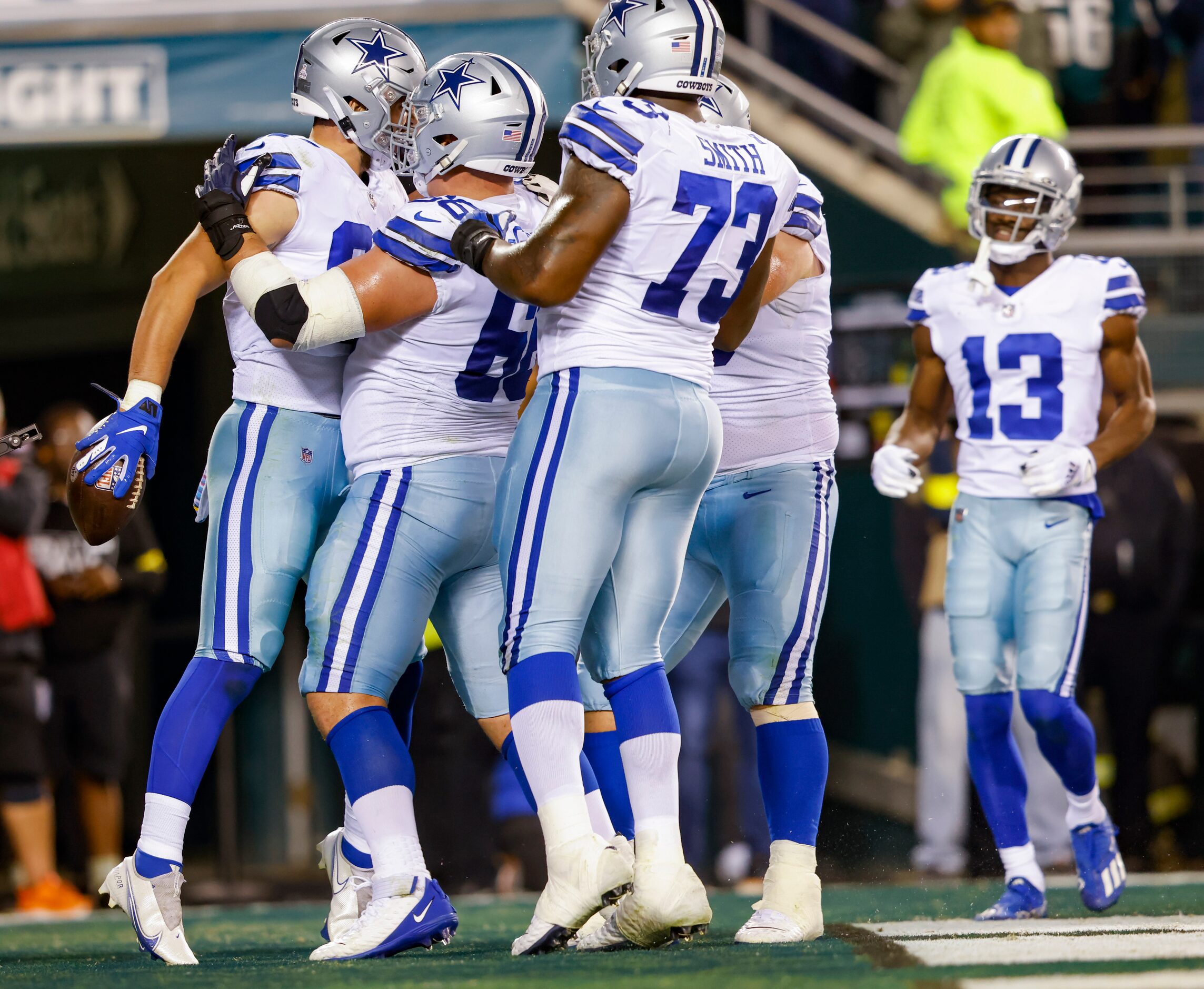 Dallas Cowboys tight end Jake Ferguson (87) celebrates a touchdown with Dallas Cowboys guard...