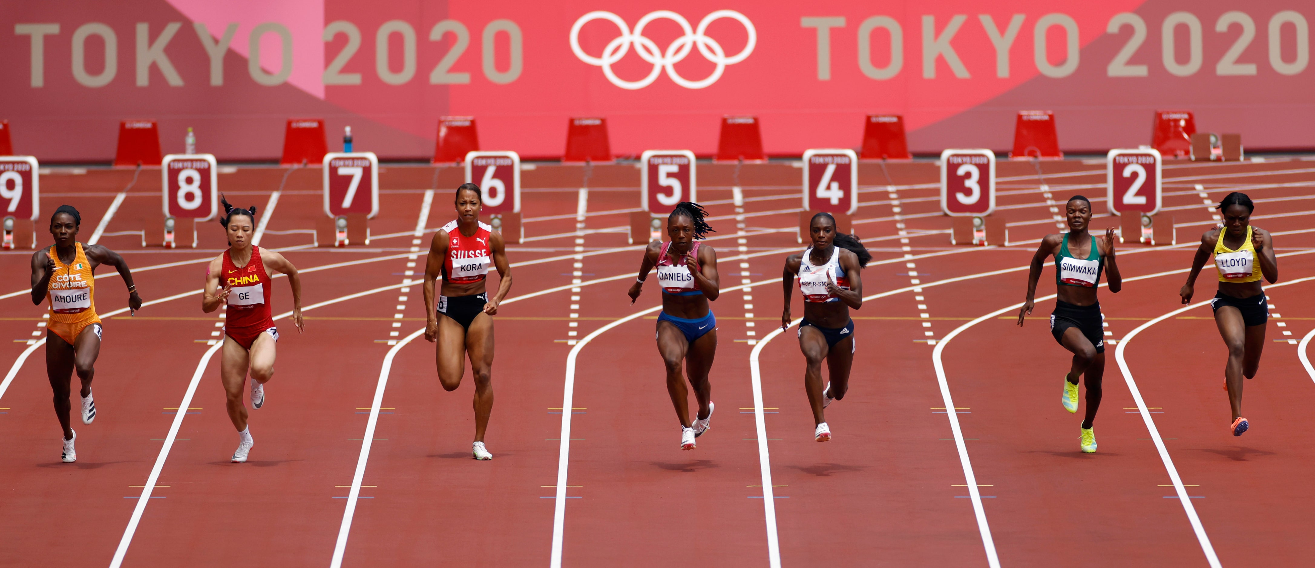 USA’s Teahna Daniels (lane 5) competes in the  women’s  
100 meter race during the postponed...