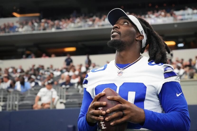 Dallas Cowboys defensive end DeMarcus Lawrence watches from the sidelines during the second...