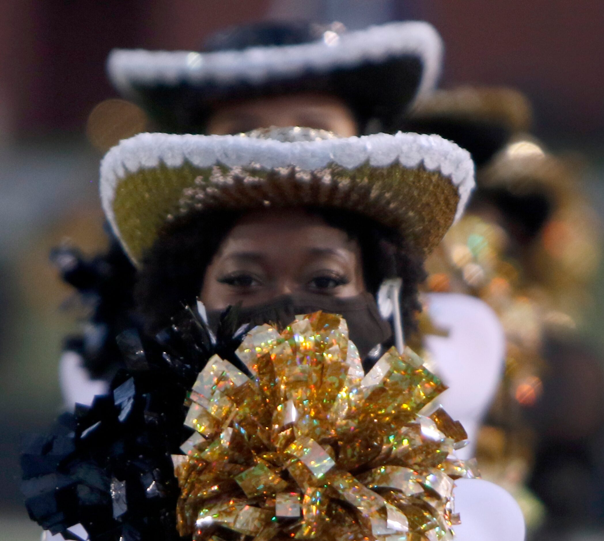 Members of the Royse City drill team stand at attention on the field awaiting the arrival of...