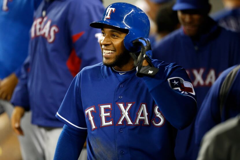 SEATTLE, WA - APRIL 13:  Elvis Andrus #1 of the Texas Rangers smiles in the dugout after...
