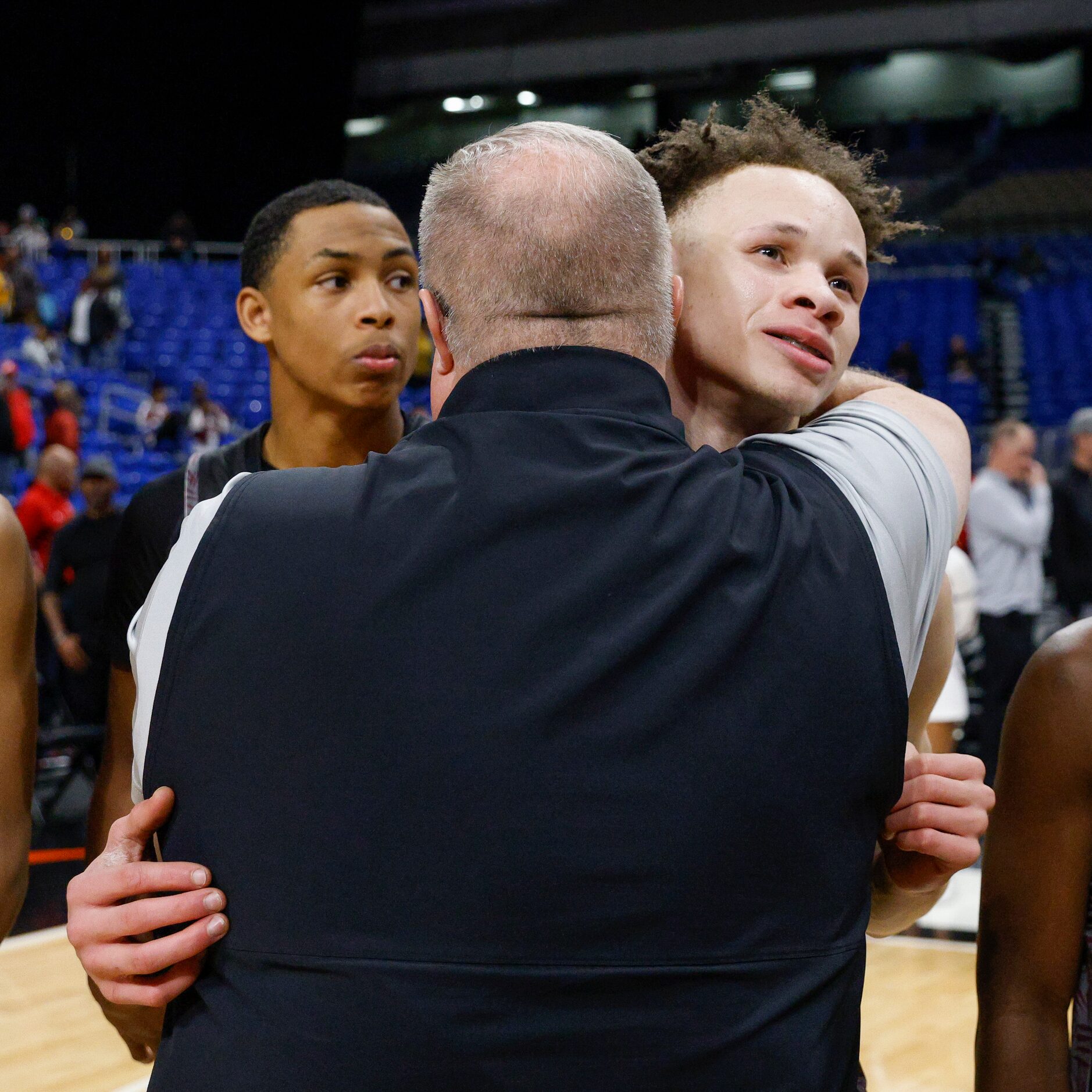 Philip O’Neal, Mansfield ISD executive director of athletics, hugs Mansfield Timberview...