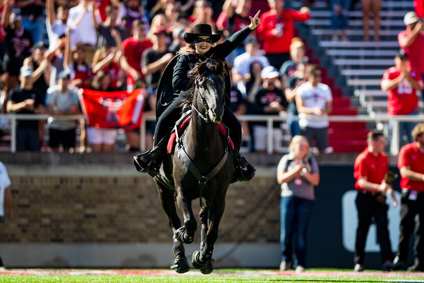 LUBBOCK, TEXAS - OCTOBER 05: The Masked Rider, mascot of the Texas Tech Red Raiders, leads...