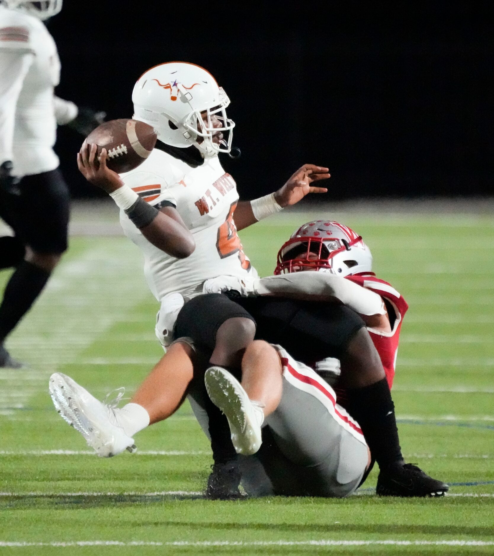 Woodrow Wilson senior defensive lineman Max Elkman (33) sacks W.T. White quarterback Jaydyn...