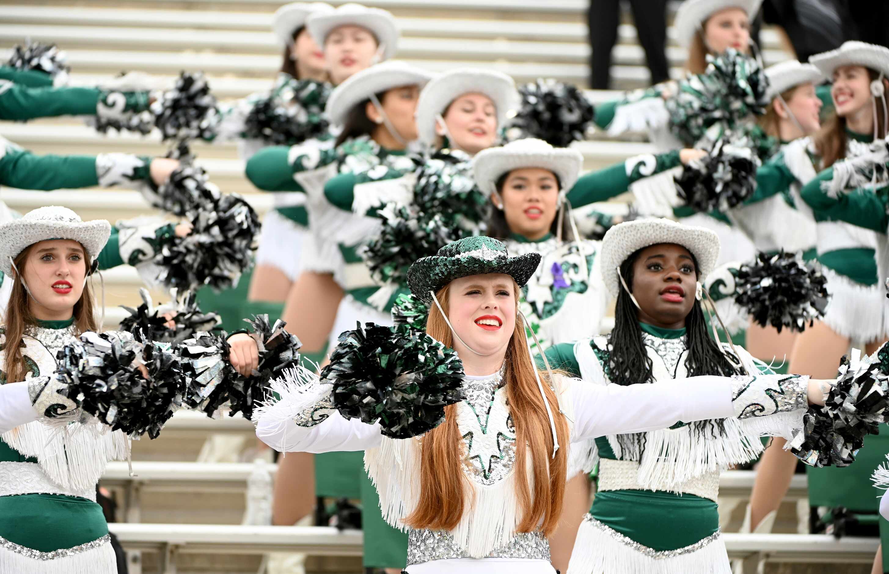 The Prosper drill team performs in the stands in the first half of a Class 6A Division II...