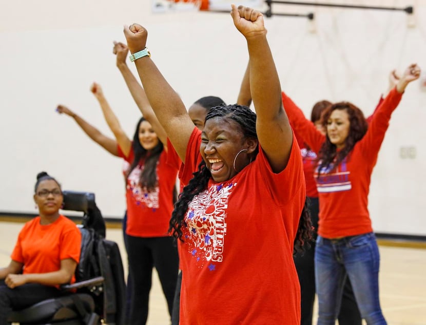 
Lauryn Duncan (center) and her fellow Duncanville Sparklers demonstrate a cheer at...