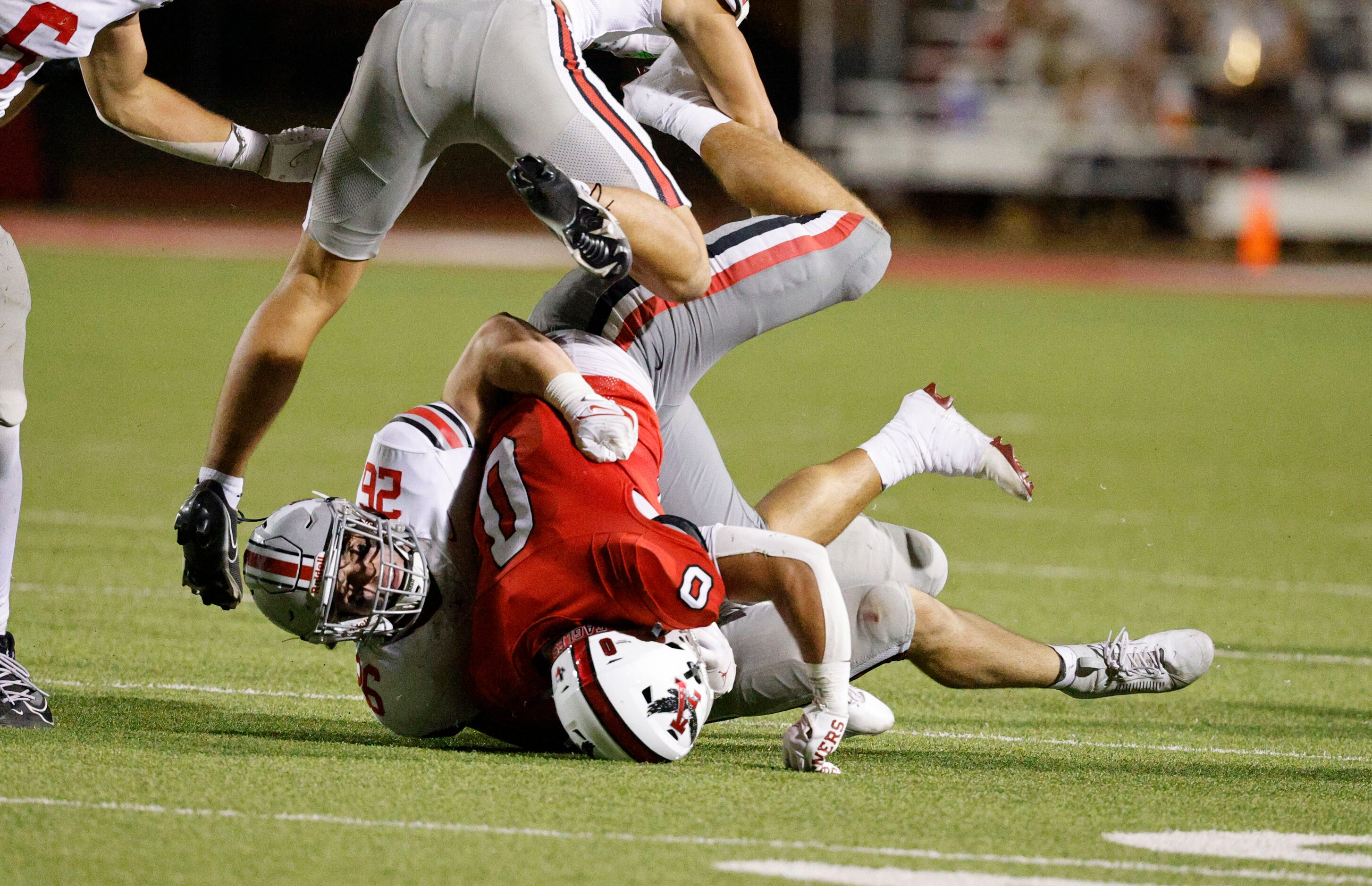 Lovejoy's Payton Pierce (26) tackles Argyle's Devon Owen (0) as Lovejoy's RJ McIntosh (2),...