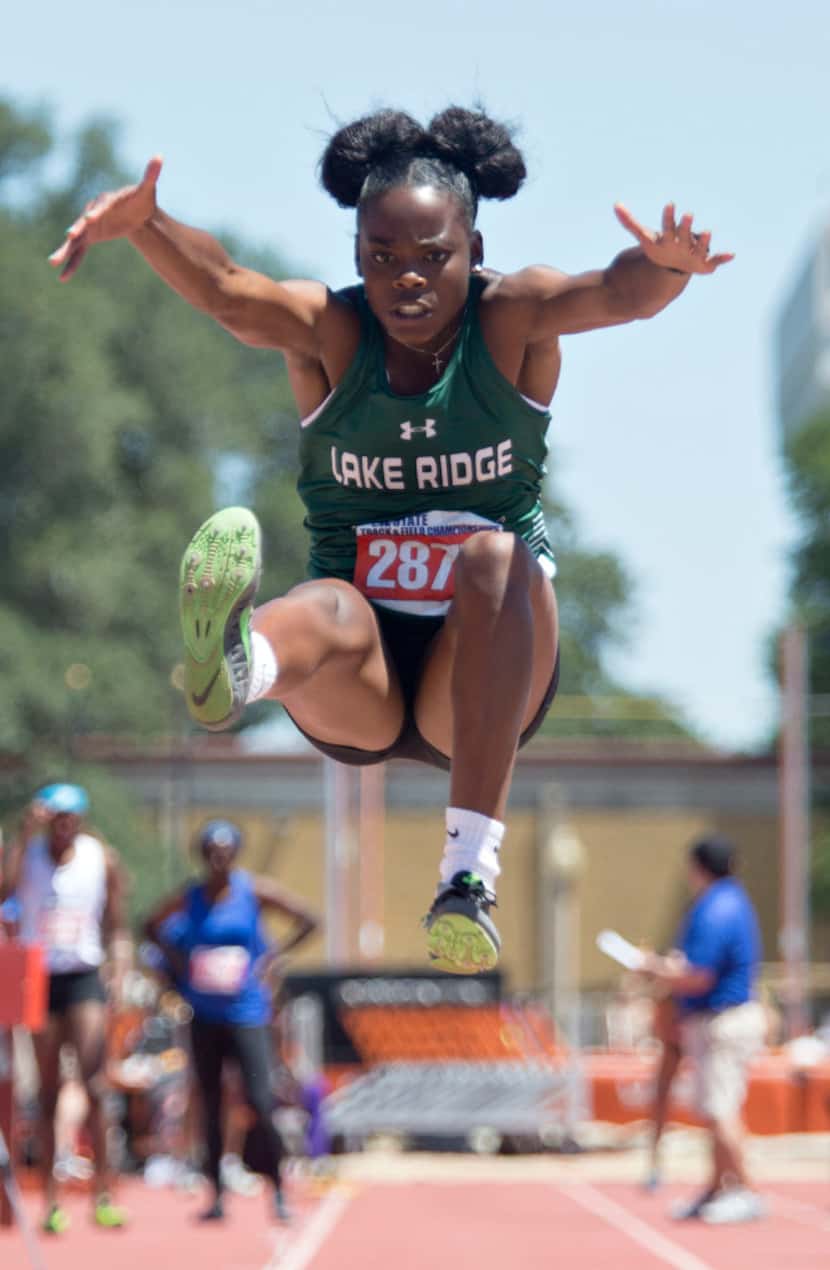 Mansfield Lake Ridge's Jasmine Moore takes a jump during the 5A girls long jump during the...
