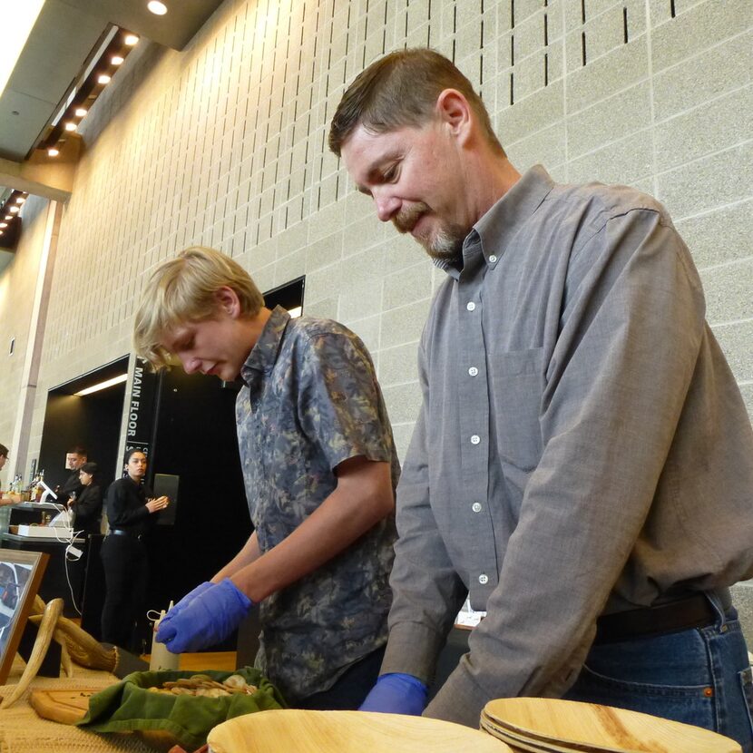 Chris Hughes from Broken Arrow Ranch prepares summer venison sausage samples for the Meet...