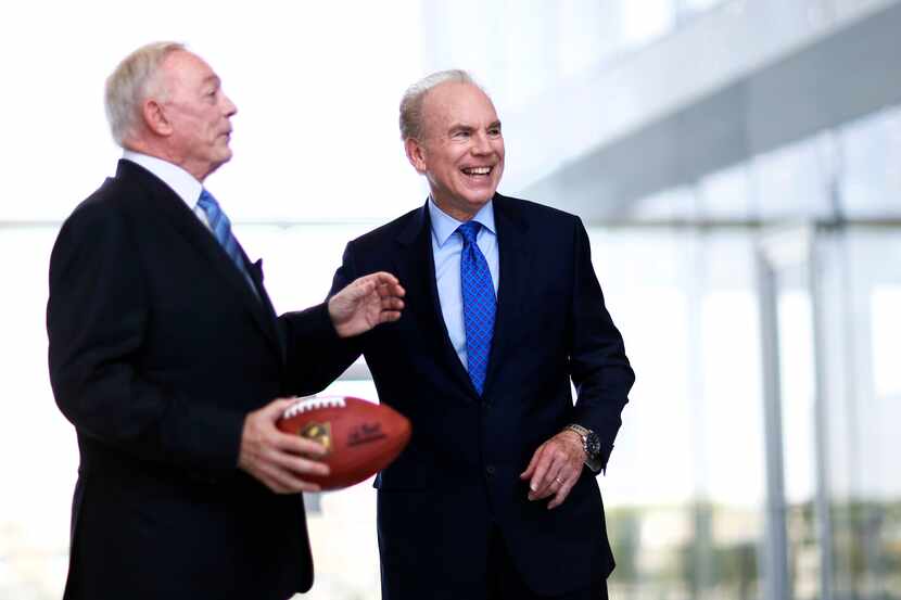 Former Dallas Cowboys quarterback Roger Staubach shares a laugh with Dallas Cowboys owner...