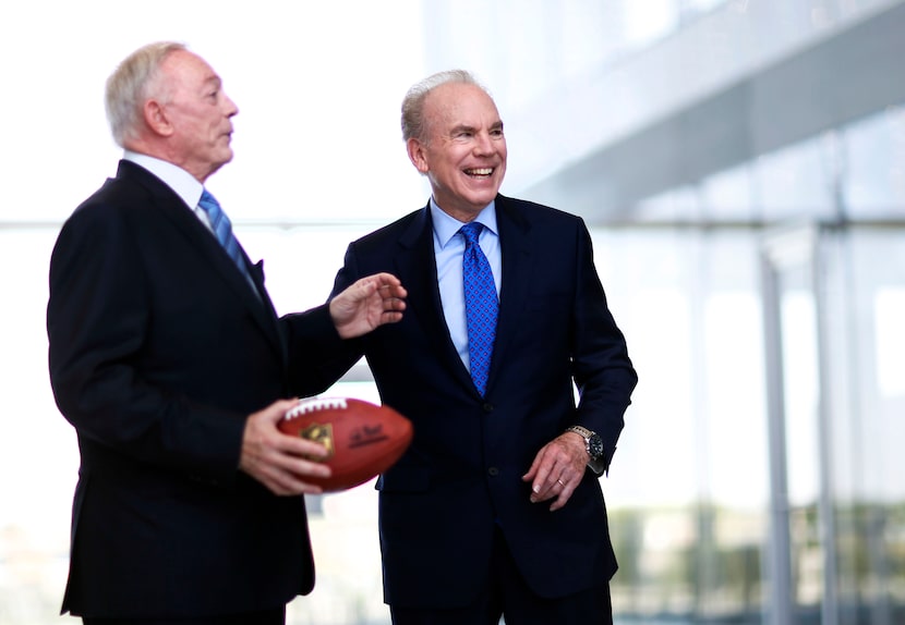 Former Dallas Cowboys quarterback Roger Staubach shares a laugh with Dallas Cowboys owner...